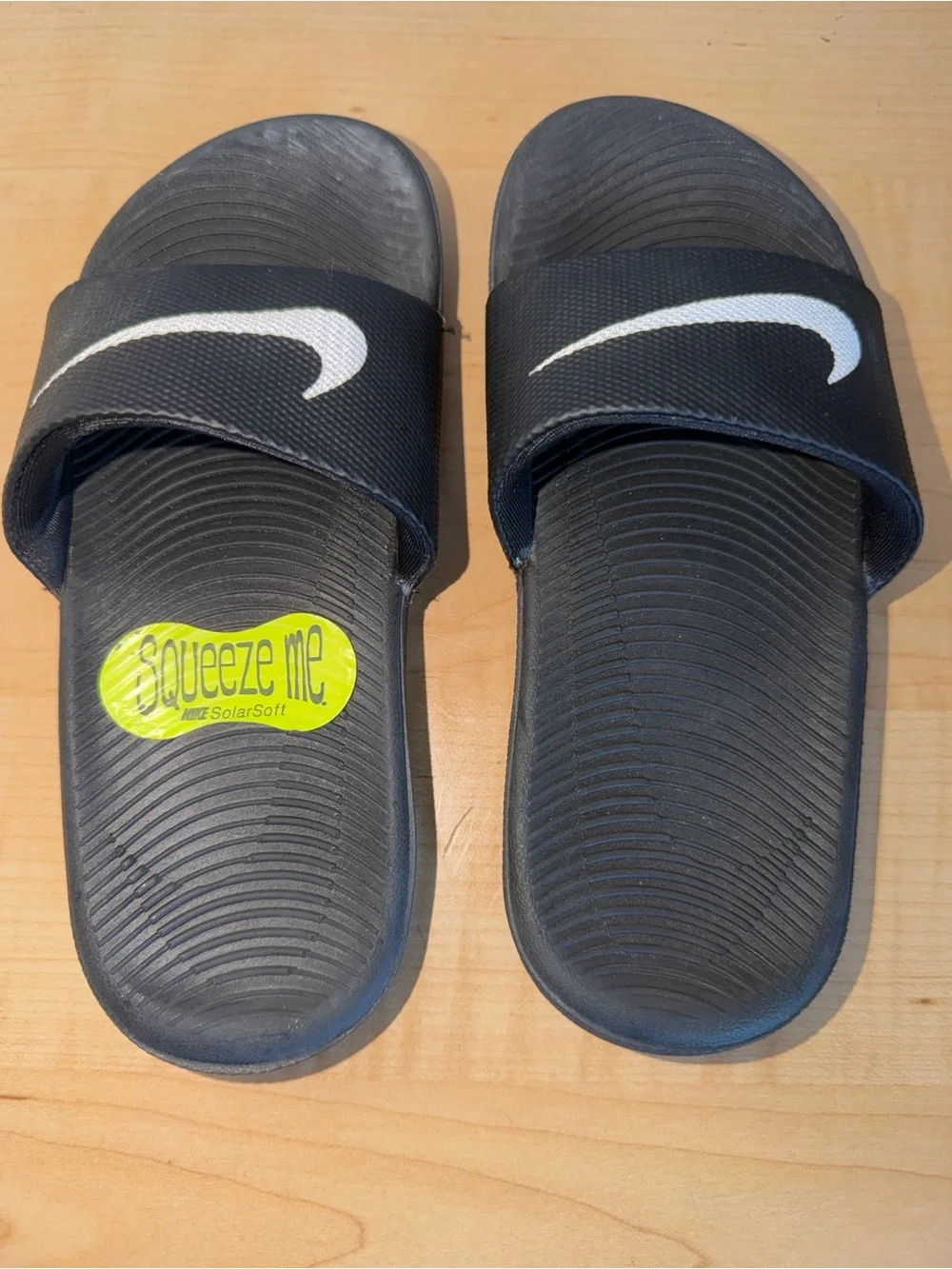 Youth Nike Black Slides with White Swoosh